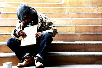 Close-up of man sitting outdoors