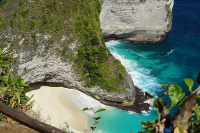 High angle view of rocks by sea