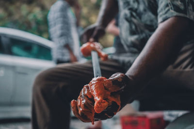 Close-up of hand holding ice cream