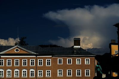 View of residential building against cloudy sky