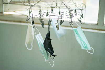 Close-up of clothespins on clothesline