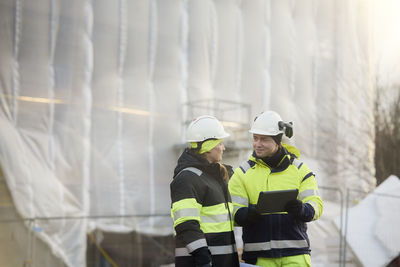 Engineers talking at building site