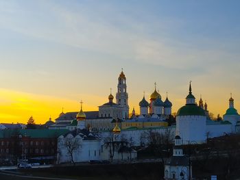 Buildings against sky during sunset