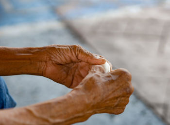 Close-up of hands preparing food