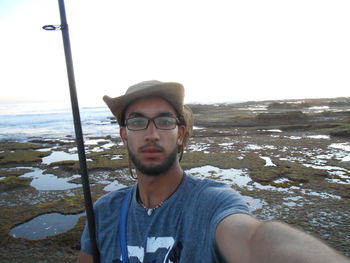 Portrait of young man on beach