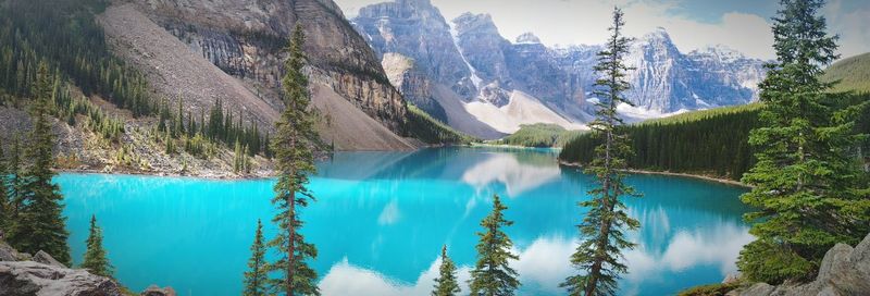 Calm lake with mountains in background