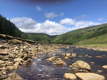 Scenic view of stream against sky