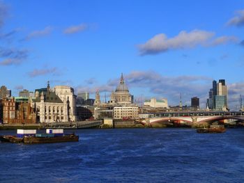 City skyline against cloudy sky