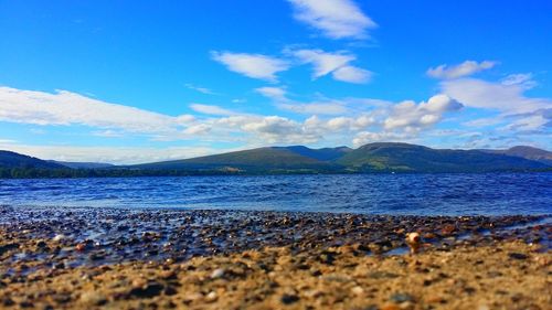 Scenic view of lake against blue sky