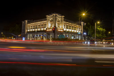 Illuminated light trails on road at night