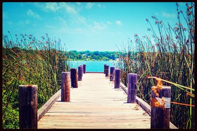 Wooden jetty leading to sea