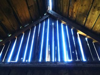 Low angle view of illuminated lights on ceiling