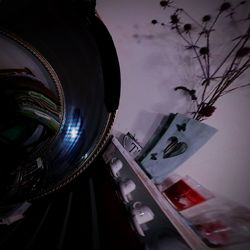 Low angle view of illuminated ferris wheel against sky