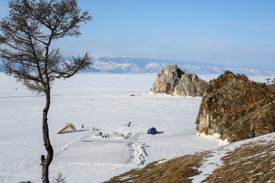 Scenic view of frozen landscape against sky