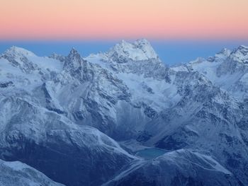 Scenic view of snow mountains against sky