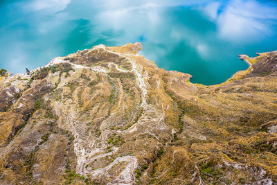 High angle view of rocks in water against sky