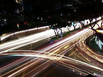 High angle view of light trails on road at night