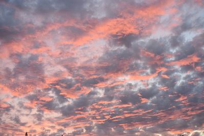 Low angle view of dramatic sky during sunset