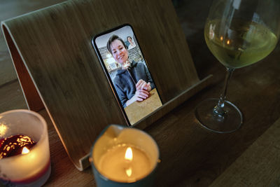 Woman with sister on video call at home