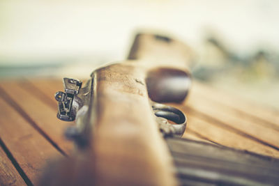 Close-up of gun on table