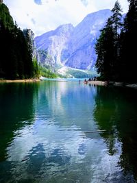 Scenic view of lake and mountains against sky