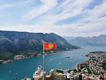 Scenic view of sea and mountains against sky