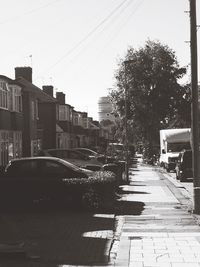 Street amidst buildings in city against sky