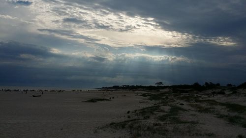 Scenic view of beach against sky during sunset