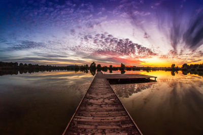 Panoramic view of beach against sky during sunset