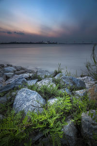 Scenic view of lake against sky during sunset