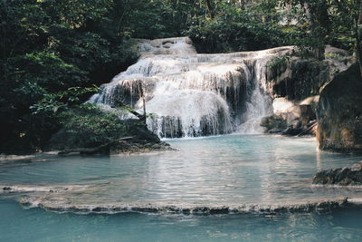 Scenic view of river flowing through rocks