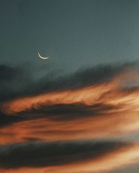 Low angle view of moon in sky at night