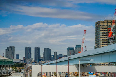 Buildings in city against sky