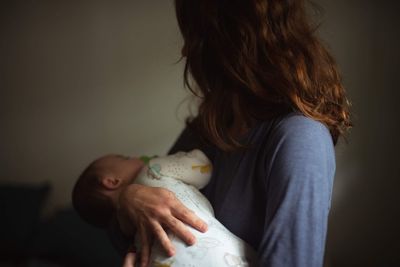 Midsection of mother and daughter