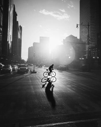 Man riding bicycle on street in city