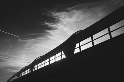 Low angle view of silhouette bridge against sky at sunset