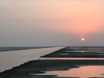 View of sea against clear sky during sunset