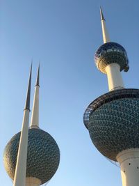 Low angle view of communications tower against sky