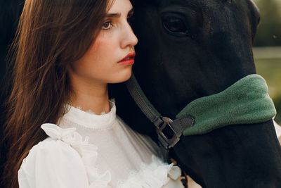 Close-up of young woman looking away