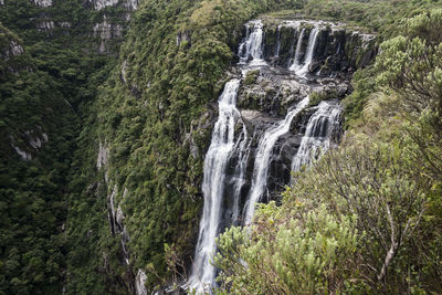 Waterfall of a river over the brazilian canyons in the guarani aquifer, nature and virgin vegetation