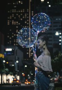 Side view of woman standing at bubbles