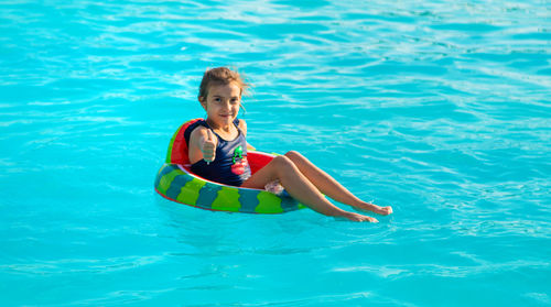 High angle view of woman swimming in pool