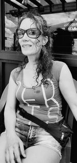 Portrait of smiling young woman sitting in bus