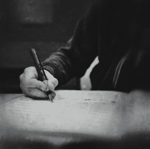 Close-up of hand holding paper