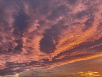 Low angle view of dramatic sky during sunset