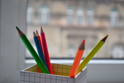 Close-up of colored pencils on table