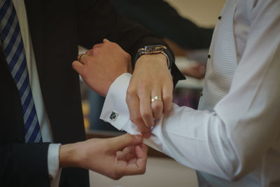 Close-up of couple holding hands