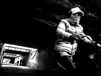 Low angle view of man and woman at night