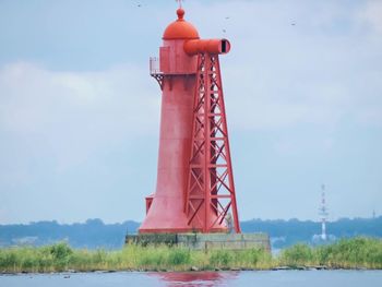 Red tower against sky