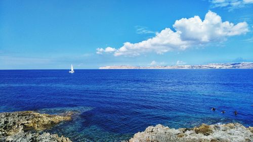 Scenic view of seascape against blue sky